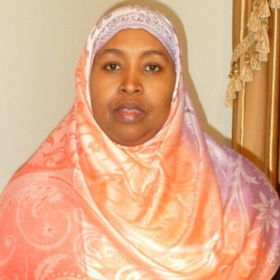 A woman wearing a brightly coloured hijab.